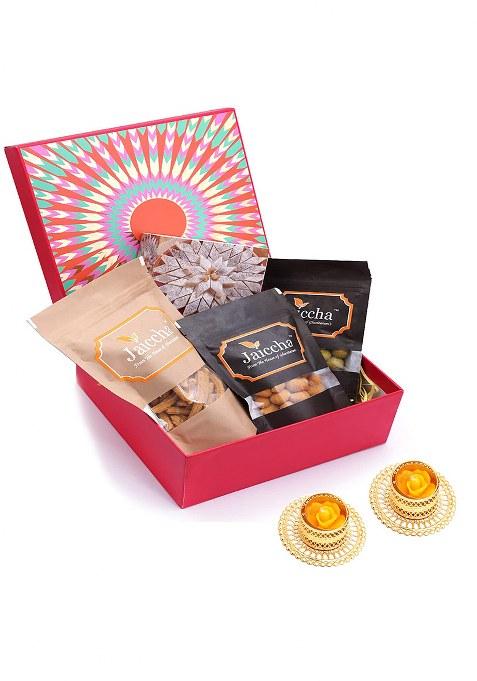 Jaiccha Ghasitaram Gifts - Express Delivery Diwali Red Hamper Box Of Kaju Katlis, Crunchy Coated Cashews, Peanuts, Butter Chakli Sticks And T-Lites