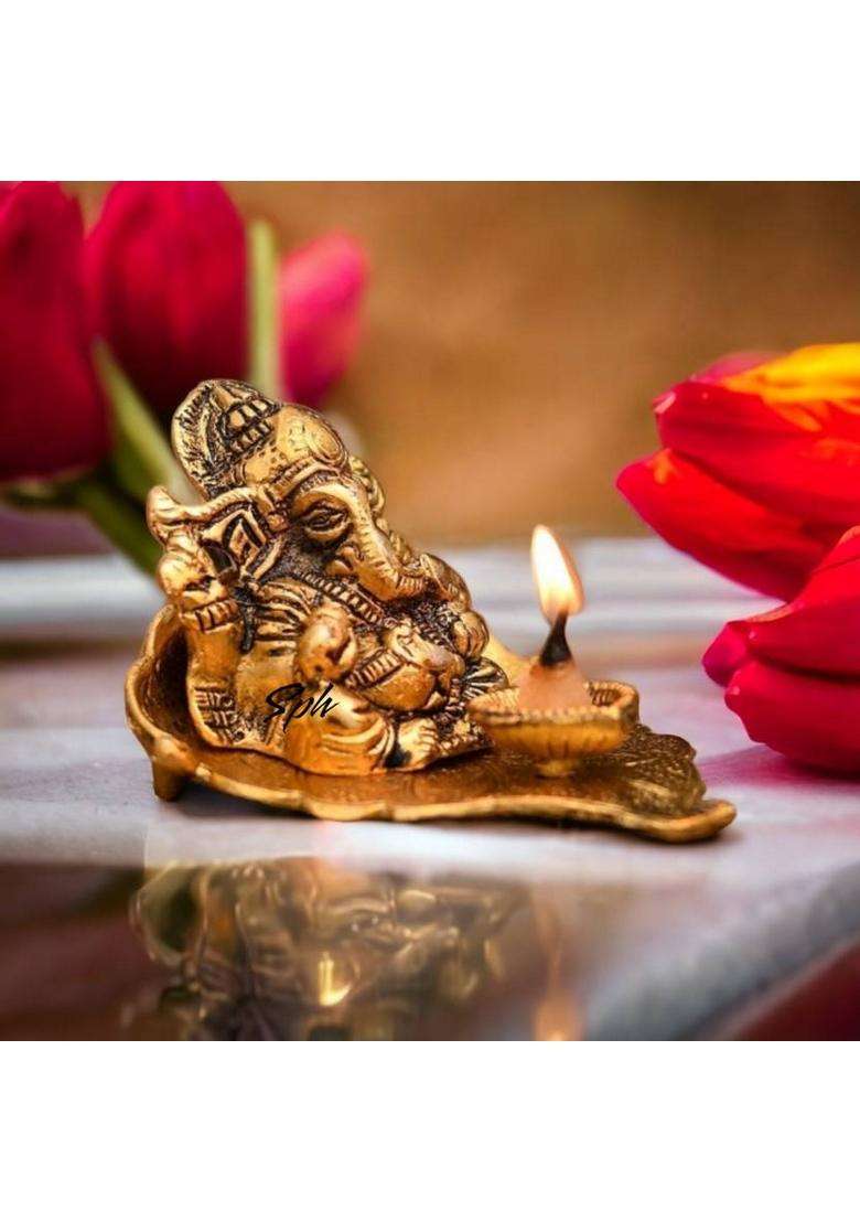 Sp Handicrafts Leaf Ganesh With Diya Lord Ganesha Metal Hand Craved For Home Decorative Gift Puja Diwali Gift Decorative Showpiece - 9 Cm(Aluminium Gold) - Indya