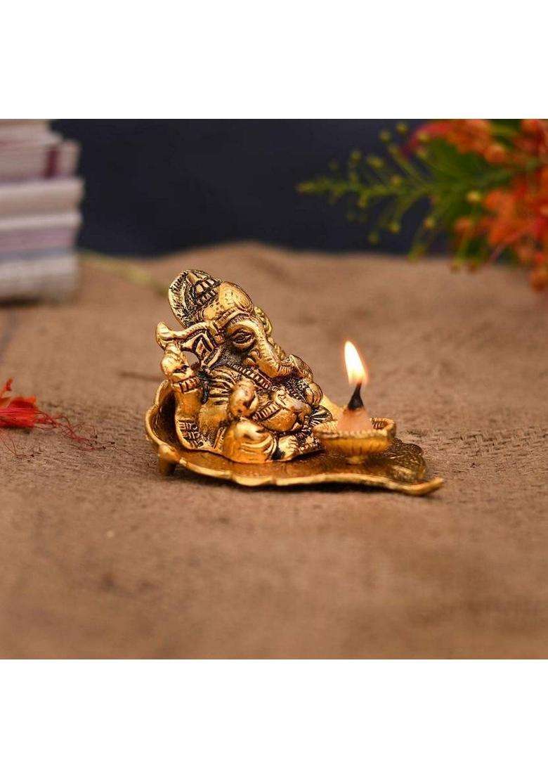 Sp Handicrafts Leaf Ganesh With Diya Lord Ganesha Metal Hand Craved For Home Decorative Gift Puja Diwali Gift Decorative Showpiece - 9 Cm(Aluminium Gold) - Indya
