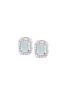 Premium Photo  White gold diamond earrings isolated on blue background