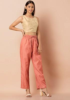 Female peach color new trousers young woman cotton colored jeans isolated  on white background youth summer fashionable  CanStock